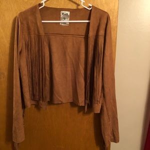 Tan short vest with fringe on front, back and arms. Really cute. Size S